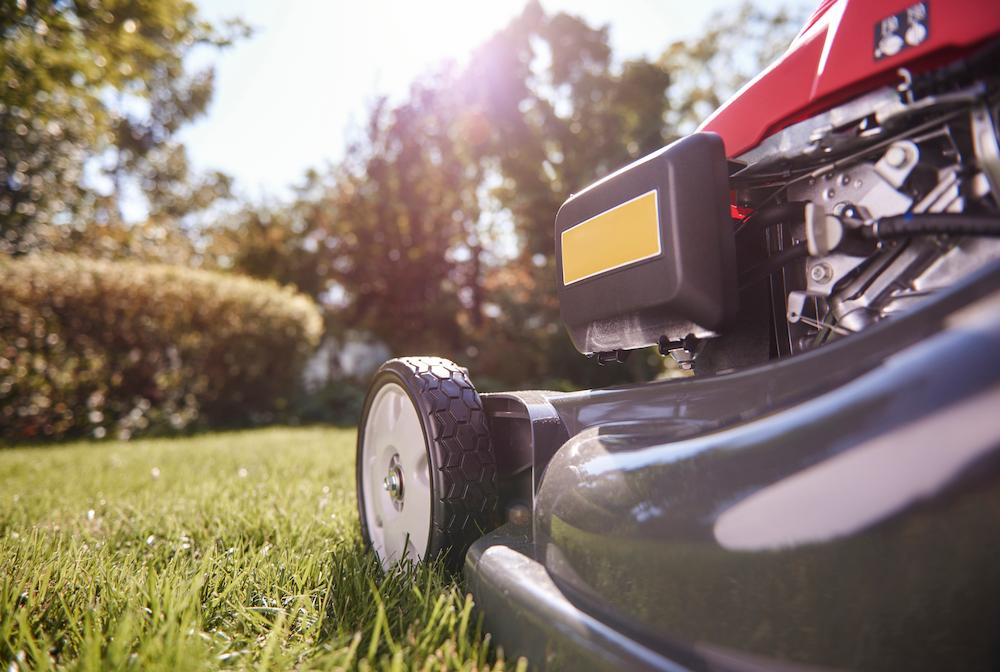 A one man mowing company looks after a customer's lawn.